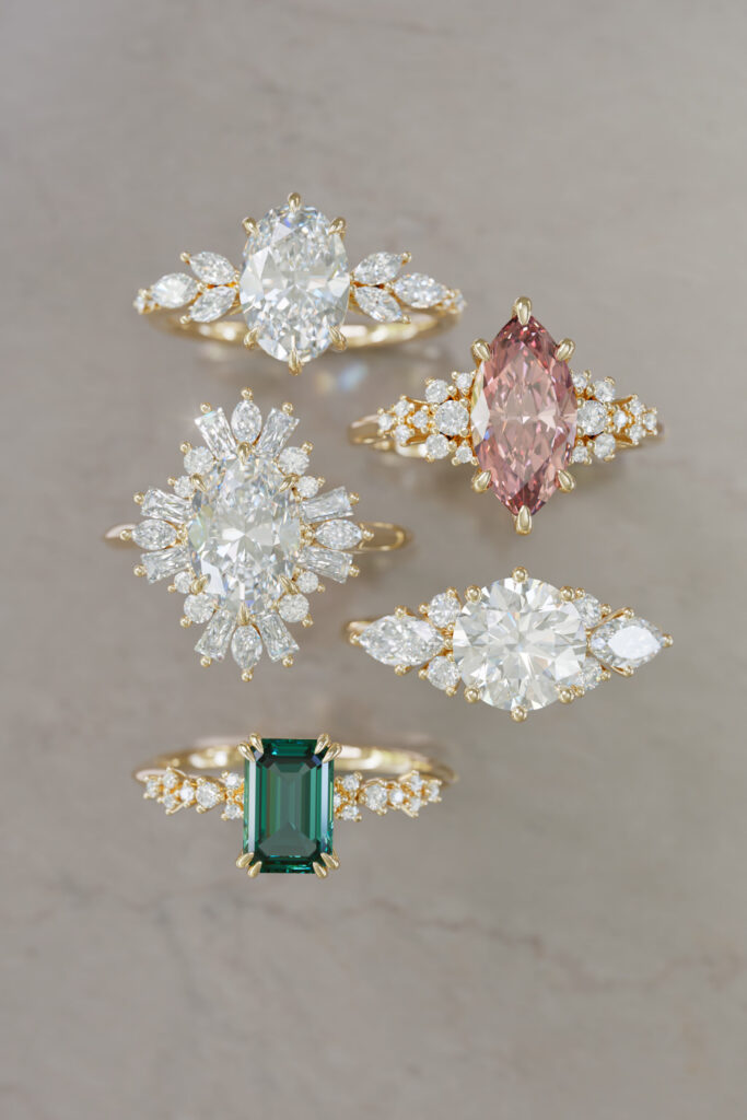 A group of multi-colored lab grown diamond engagment rings