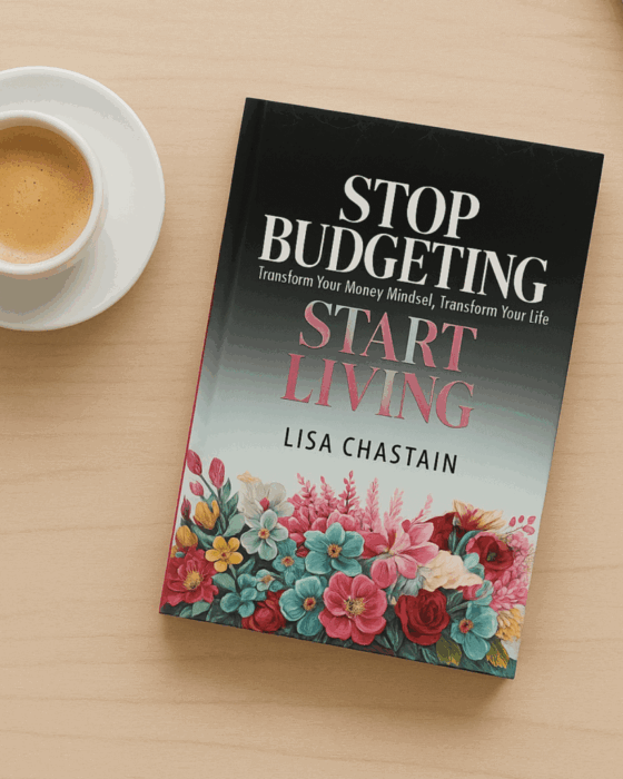 The book Stop Budgeting Start Living by Lisa Chastain with a cup of coffee on a beige table