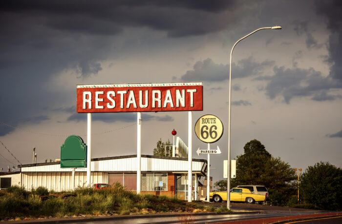 Restaurant sign along historic Route 66 in Texas. Vintage Processing.