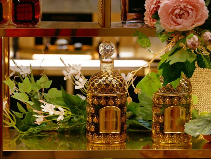 Bottles of Guerlain luxury perfumes for women. "Aqua allegoria" in the mythical “bee bottle” displayed in a store
