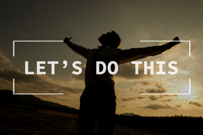 Let's do this text over silhouetted person with spread arms in countryside sunset.