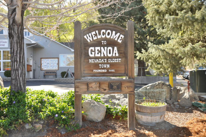 Wooden welcome sign marking Genoa as Nevada’s oldest town, founded in 1851.