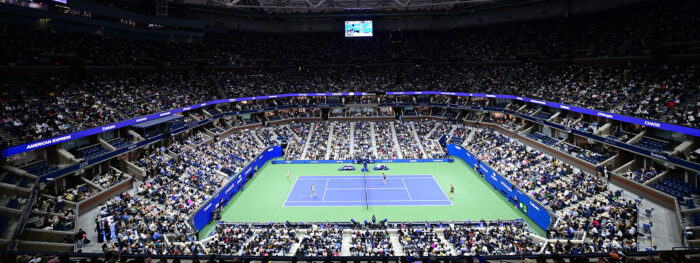 Wide view of a packed Arthur Ashe Stadium during a US Open tennis match in Flushing Meadows, New York.