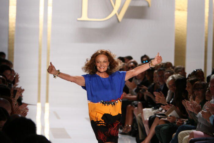 Coach marked 85 years. Diane von Furstenberg returned to the official New York Fashion Week schedule after nearly a decade. Proenza Schouler revived the PS1 bag, which was an “It” bag of another era. The Council of Fashion Designers of America and eBay assembled more than 150 archival pieces of American fashion for an exhibition timed to the week. Some reached beyond fashion itself, tapping into American art, architecture, family history, subculture and place to inform their Spring 2027 collections. Rachel Comey devoted her 25th anniversary show to Rosalyn Drexler, the late painter, playwright and one-time professional wrestler she called “such a New York character.” Drexler’s books, artwork and years at the historic Judson Theatre worked their way into the collection. Anna Sui found inspiration while flipping through a 1972 issue of Vogue. “An American Fantasy,” a feature about an art-filled Southampton, New York, beach house, became the starting point for Spring 2027. Joseph Altuzarra looked north to the Catskills and Casa Susanna, the midcentury retreat where a group of men gathered to dress as women away from the scrutiny of everyday life. At Lafayette 148, Emily Smith started much closer to home with a quilt her grandmother made from old aprons. It carried her back to childhood road trips through Ohio cornfields and “the heartland, the workwear.” A New York artist. A Southampton beach house. A Catskills refuge. An Ohio quilt. That’s a lot of America to find its way into one Fashion Week. All those anniversaries, returns and rediscoveries leave one question hanging over the week: What does American fashion mean now? It’s a topic Eleanor Lambert faced in 1943 when she created Press Week, the precursor to NYFW, to give U.S. designers an identity and audience outside Paris’ enormous shadow. Fast forward 83 years, and American fashion no longer needs anyone’s permission to occupy the world stage. What matters now is what it chooses to say once it’s in the spotlight. One hallmark American fashion has long put front and center is utility. After all, clothes are meant to be lived in, not merely looked at. Trish Wescoat Pound drew on the American sportswear tradition of Claire McCardell and Bonnie Cashin—designers who helped make ease and movement part of the country’s fashion vocabulary—for TWP’s Spring 2027 collection. Wescoat Pound grew up near the Kansas-Oklahoma border before building her career in New York, a mix of usefulness and polish evident in her clothes. Then there’s Ralph Lauren who has spent decades showing how many different versions of American style can live under one label. His Spring 2027 collection paired ornate fabrics with cargo pants and velvet with faded denim, continuing a careerlong conversation among Western wear, prep, workwear and evening clothes. That range may tell us more about American fashion than any single look coming down a runway.
What’s clear is that the American fashion archive is no longer simply a collection of old clothes. It’s art and architecture. Family handwork and hidden communities. Midwest farmland and New York characters. It stretches from the polished mythology of the Hamptons to a Catskills retreat that once offered people somewhere safe to become themselves. Even the phrase “American fashion archive” is an interesting one. Archives preserve what came before; but fashion has a habit of pulling those relics back into circulation to see what else they can become.
Suddenly, a grandmother’s quilt becomes an ivory and white leather jacket. Photographs from Casa Susanna find new life in full 1950s-style skirts. A 1972 Southampton beach house reappears in pajama-like separates. An “It” bag from another era returns softer, slouchier and ready to be carried again. It seems fashion has never been particularly good at leaving the past untouched. Nor are American designers especially interested in settling on a single inheritance, judging from this year’s Fashion Week. The beauty of America is that there is enough history now to draw from workwear and eveningwear, prep and subculture, family craft and fine art without asking any one of them to represent the whole country— or the whole fashion industry. Lambert worked toward a day when American fashion could stand on its own. Today, it does, with generations of design, culture and lived experience at its disposal. This season, NYFW showed how much room there still is on that stage. And how many different versions of America can step onto it.