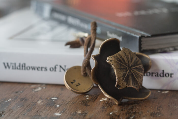 Fogo Island Inn hotel key with a solid bronze pitcher plant key fob inspired by objects found on Fogo Island.